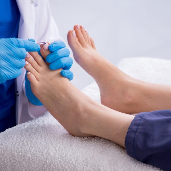 Podiatrist,Treating,Feet,During,Procedure Podiatrist,Treating,Feet,During,Procedure
