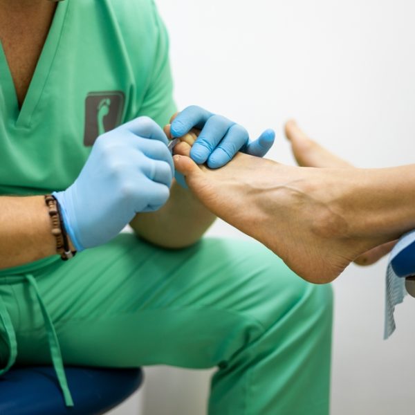 Close-up,Of,An,Unrecognizable,Podiatrist,Cuts,Toenails,During,Pedicure,Procedure.